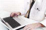 Doctor Using Laptop