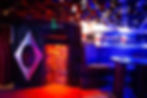 Colorful, dimly lit bar interior for private venue hire in Battersea