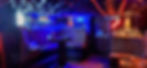 Cozy private venue with blue lighting and booth seating