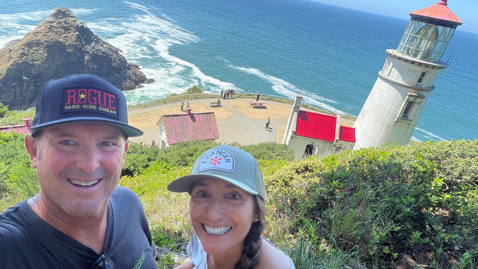 Michelle & Ty hiking near Heceta Head Lighthouse on the Oregon Coast.