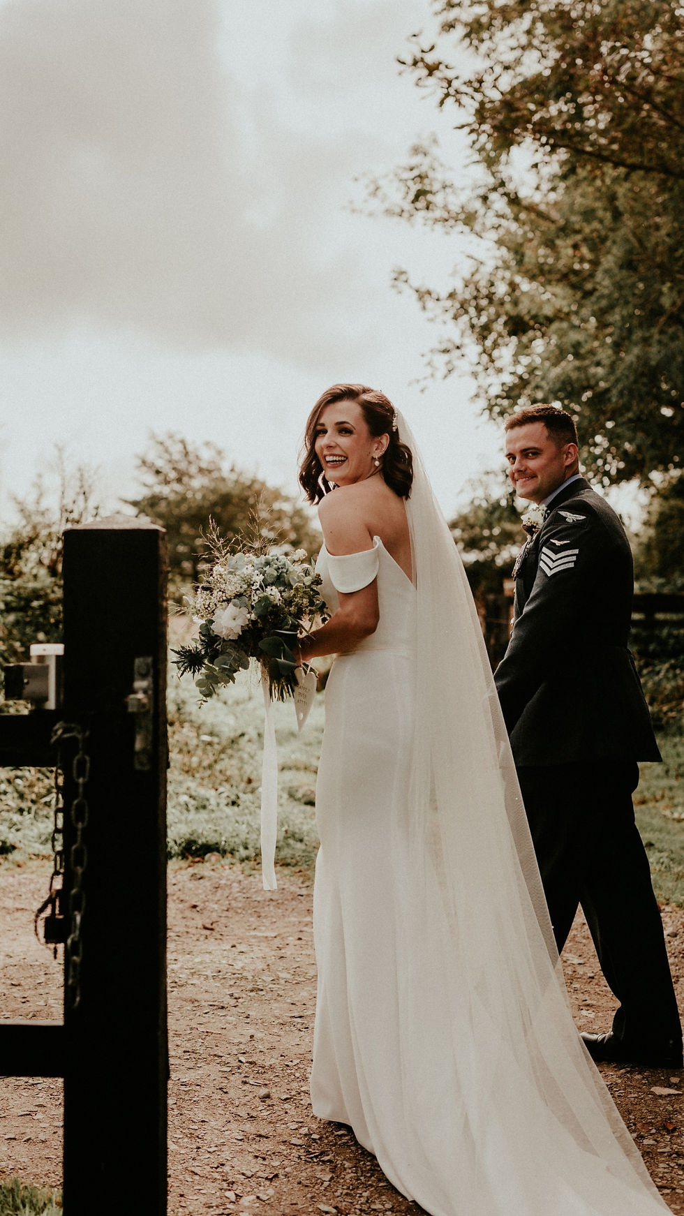 A beautiful bride and her groom together at their countryside wedding. The sun was shining and the Cornish bleach was glowing.