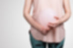 Woman with a balloon indicating a bloated abdomen