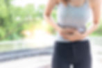 Woman clutching her abdomen in discomfort