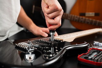 guitar-maintenance-with-chrome-bridge-adjustment-u-2026-03-04-15-23-46-utc.jpeg