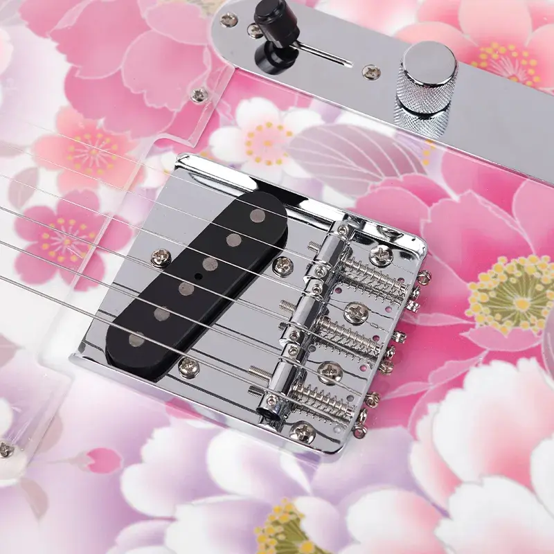 Thumbnail: `Close-up of the bridge single-coil pickup, chrome hardware, and floral pattern on a Bullfighter electric guitar.`