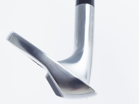 Shiny golf club wedge detailed close up shot on white background, ABOUT: WEDGES.