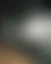 lacanche range in a green kitchen with a brass faucet and marble shelf