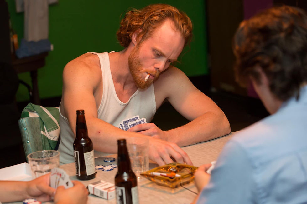 Nick Bohle, playing Stanley Kowalski in Tennessee William's "A Streetcar Named Desire," mounted by Theatre Outré in 2019 directed by Jay Whitehead. 

Rehearsal still by Tanya Plonka.

Nick sits at a table playing cards with two other men. He's smoking a cigarette in a white tank-top.