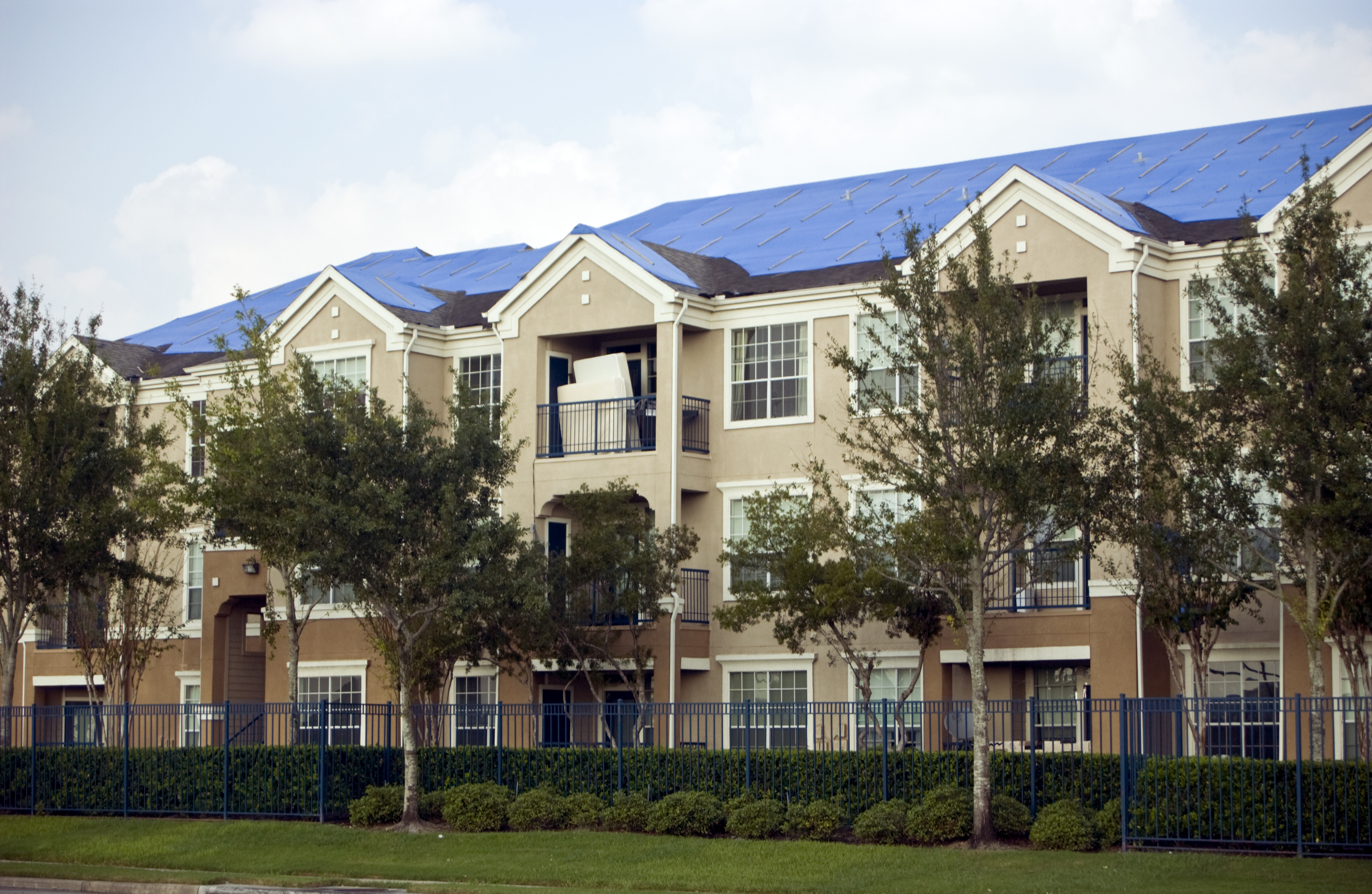 Commercial tarping of damaged roofs