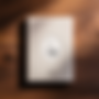A plain off-white hardcover notebook over a walnut wood surface 24-12-2024 at 12-14-04 edi