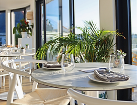 The beach-view dining room at Porth Beach Hotel