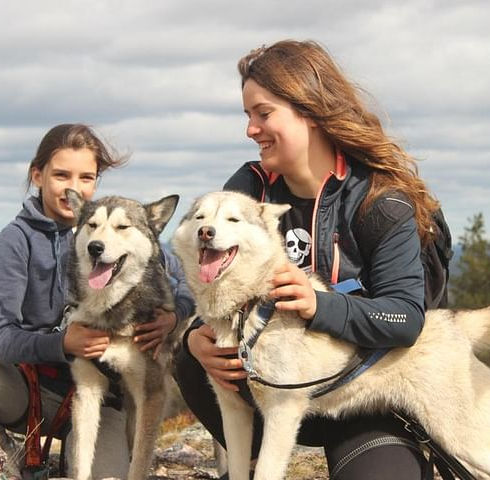 Amanda hiking with huskies.jpeg