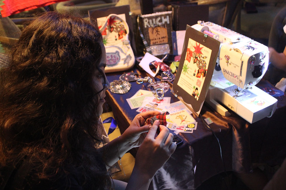 a participant familiarising themselves and customing their "cat keychain" at ruchi's atelier pop up in mumbai. Hosted at Lgauna cafe by deluxe thali.