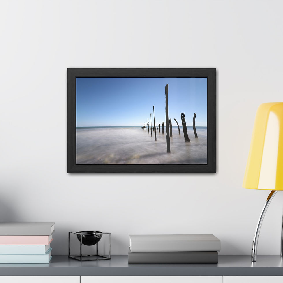 Thumbnail: Long exposure photo of weathered wooden pilings in calm, misty water.