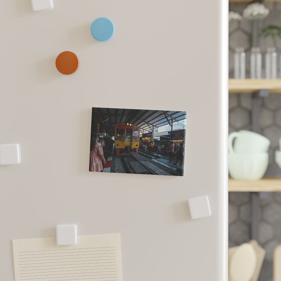Thumbnail: Refrigerator magnet displaying a photo of a yellow subway train at a station.