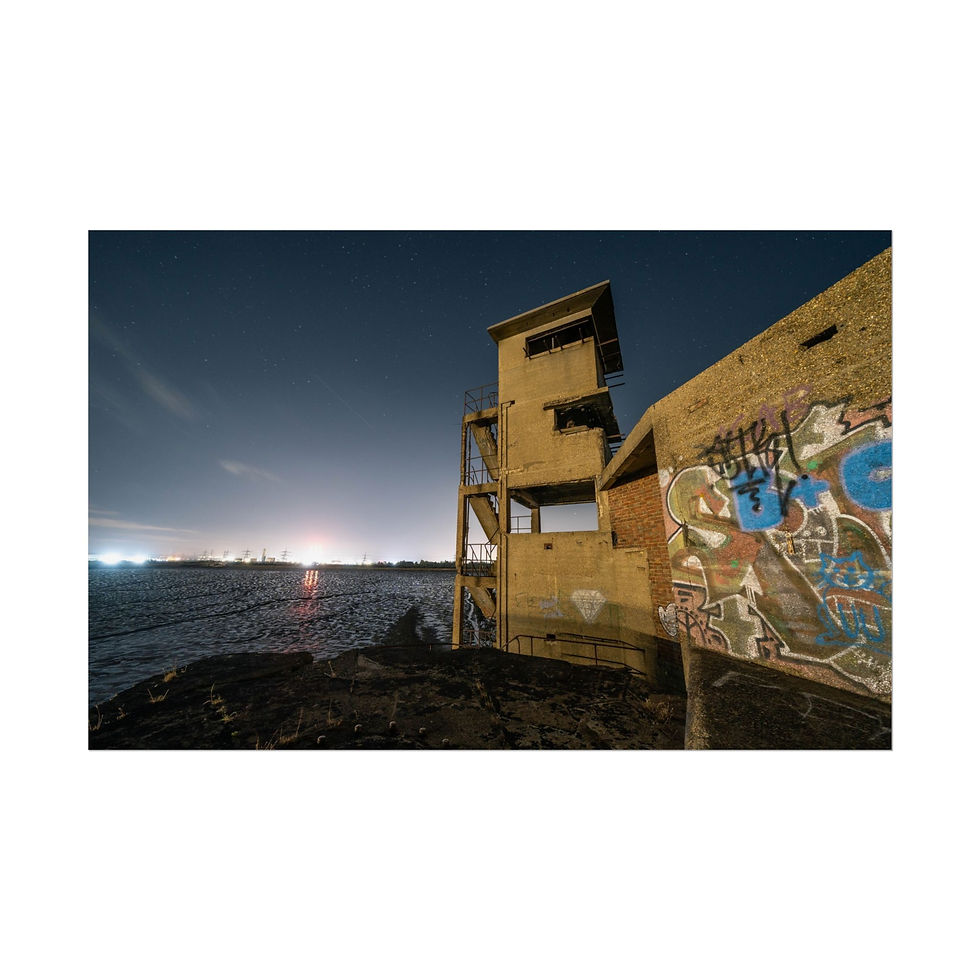 Thumbnail: Graffiti-covered abandoned building at night with distant horizon lights.