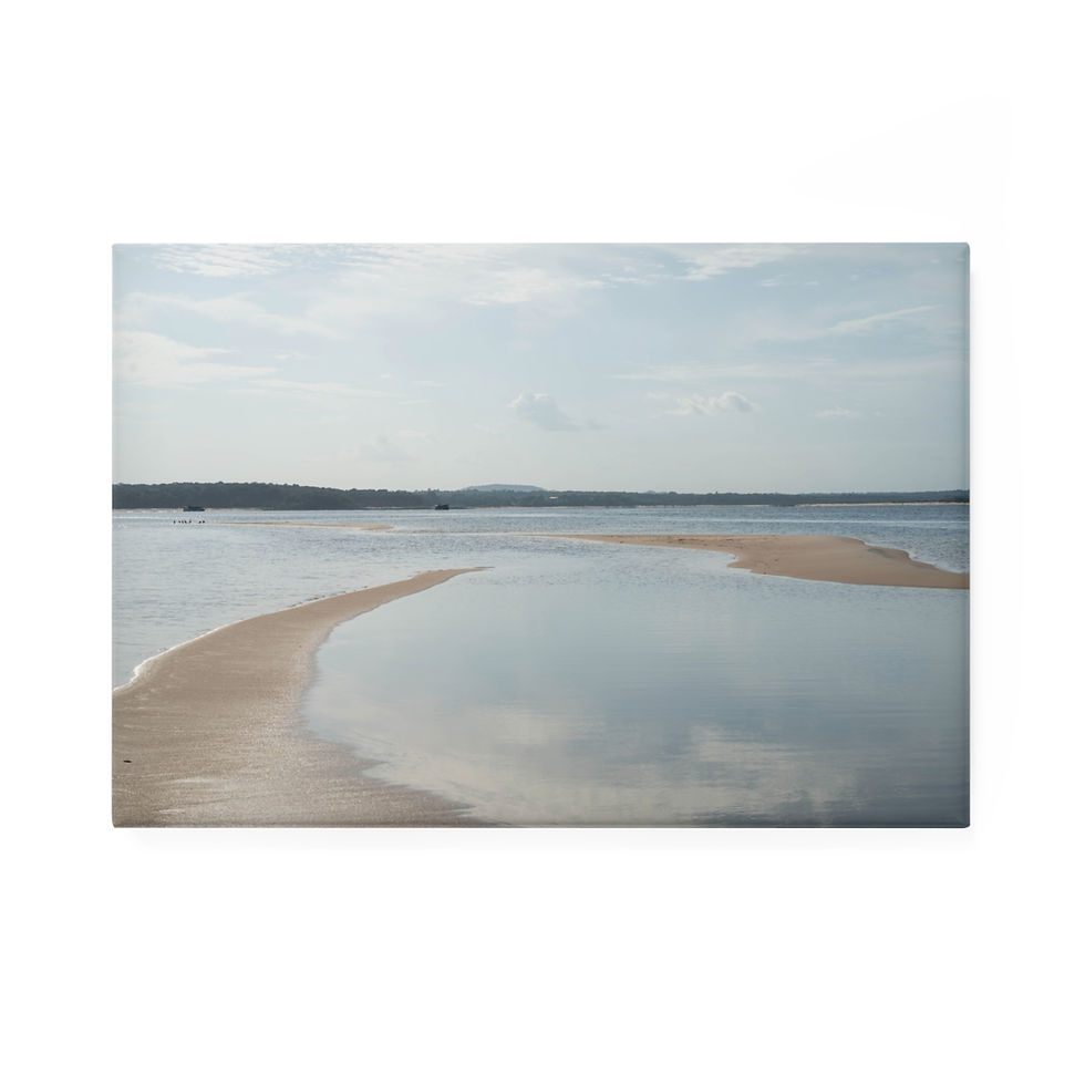 Thumbnail: Curving sandbar in tranquil water under a bright, cloudy sky.