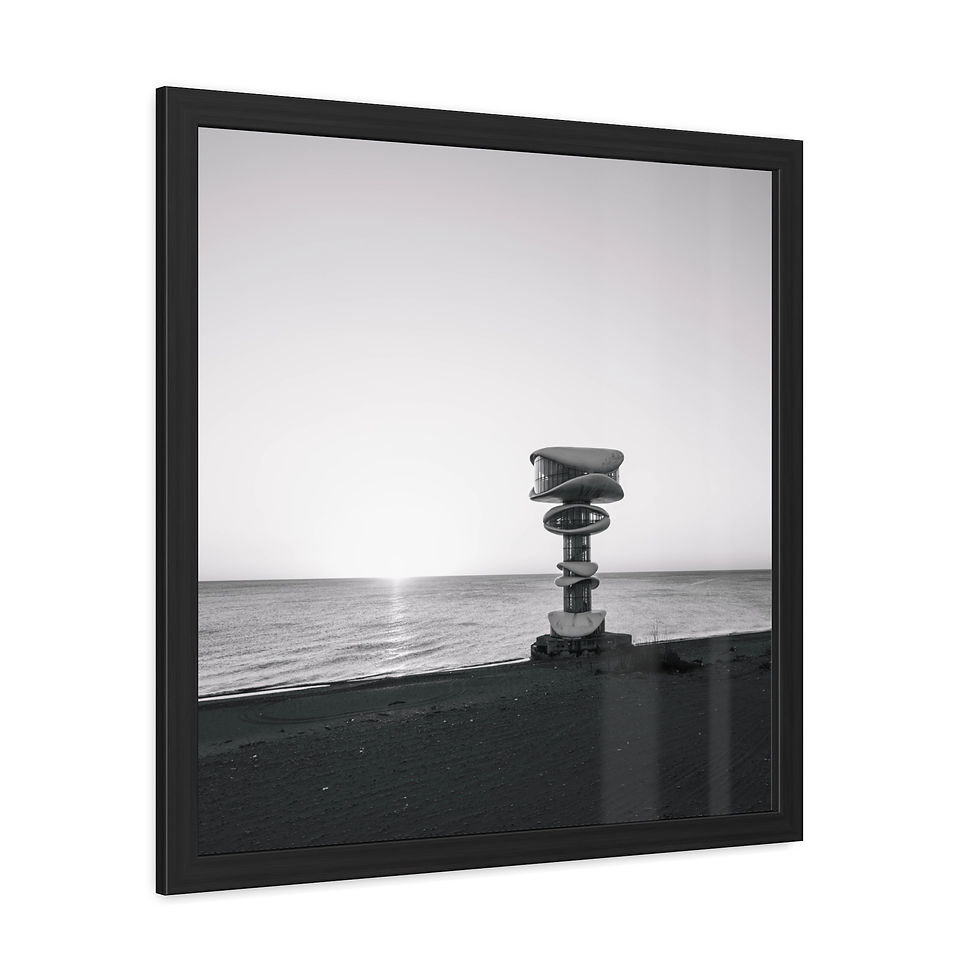 Thumbnail: Framed black and white print of stacked rocks by calm water horizon.