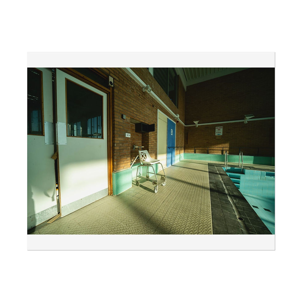 Thumbnail: Indoor swimming pool with accessibility hoist, sunlight, and brick walls.