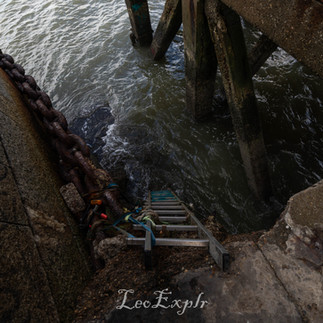 Grain Tower in Isle of Grain - Ladder leading down from an old building in the sea