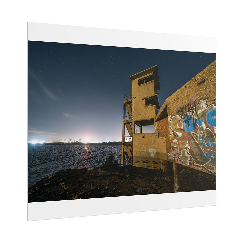 Thumbnail: Graffiti-covered abandoned coastal building at night with distant city lights.
