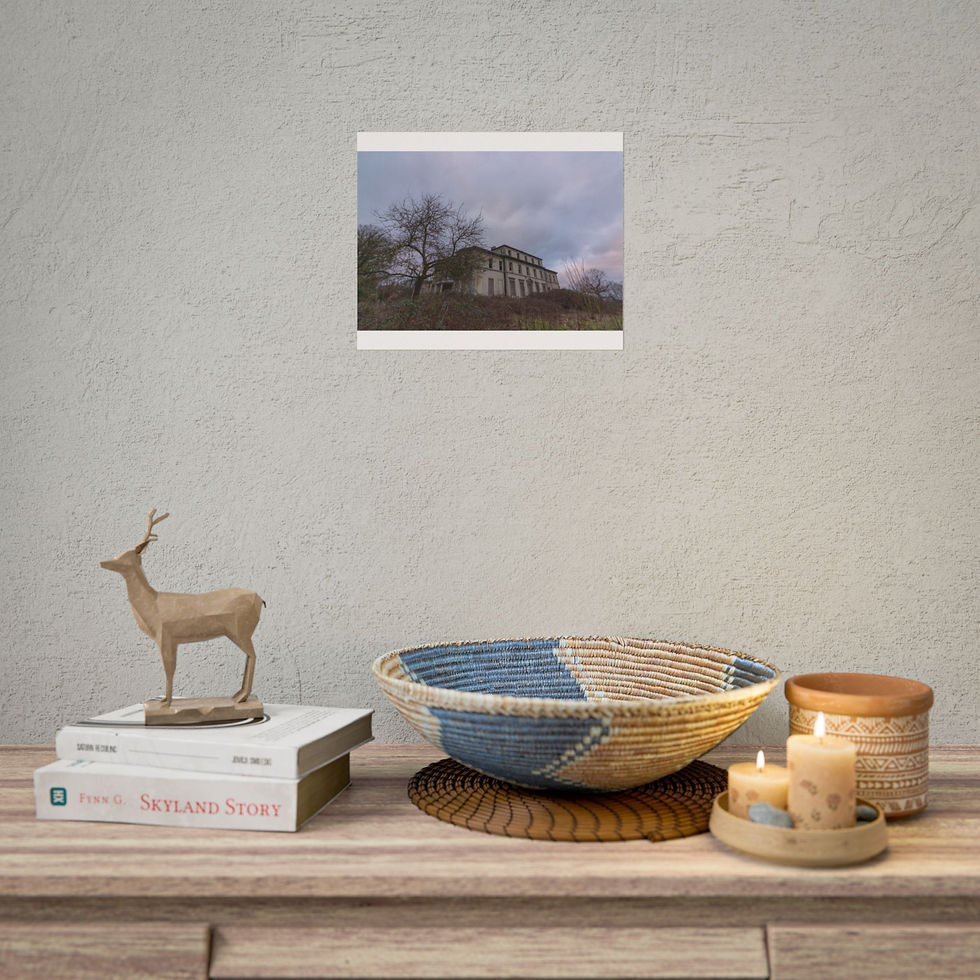 Thumbnail: Framed photograph of an abandoned building above a decorated wooden table.