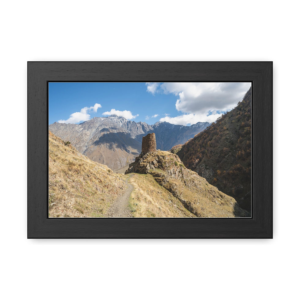 Thumbnail: Framed print of old stone tower on hill, mountainous landscape, blue sky.