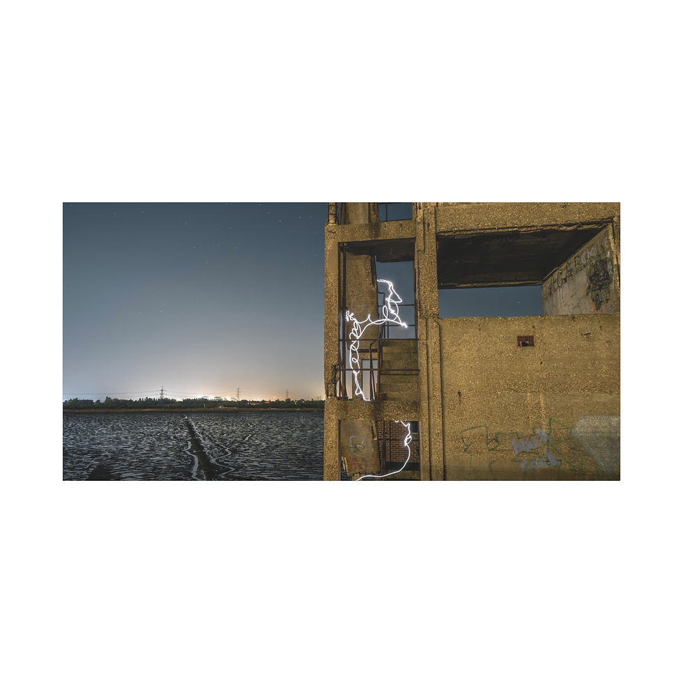 Thumbnail: Weathered yellow derelict building by vast water under clear sky.