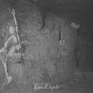 Black and white image of prominent local graffiti of a white man (l'homme en blanc) on the wall of the Paris Catacombs