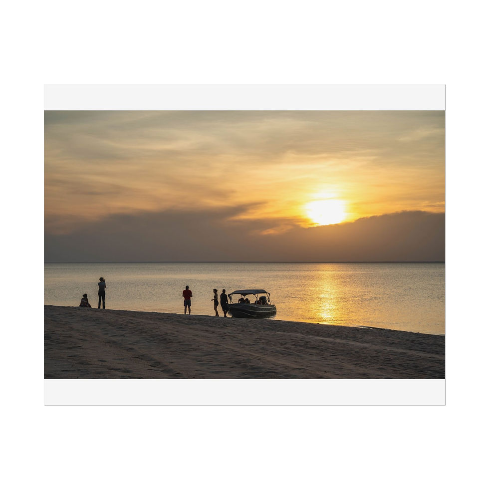 Thumbnail: Golden sunset over calm ocean, people and boat on sandy beach.