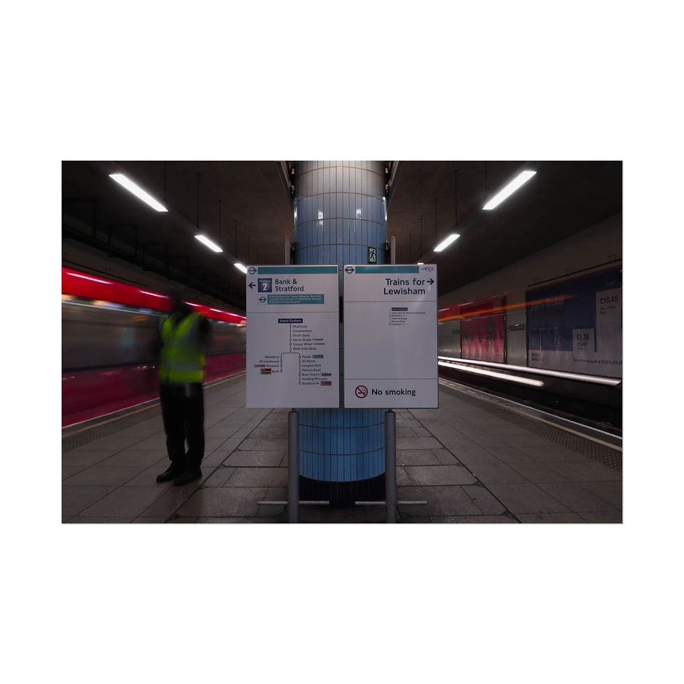 Thumbnail: Worker in high-vis vest on subway platform as train speeds past.
