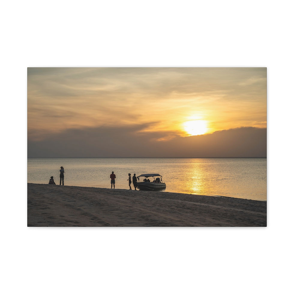Thumbnail: People and boat on beach at breathtaking sunset over calm ocean water.