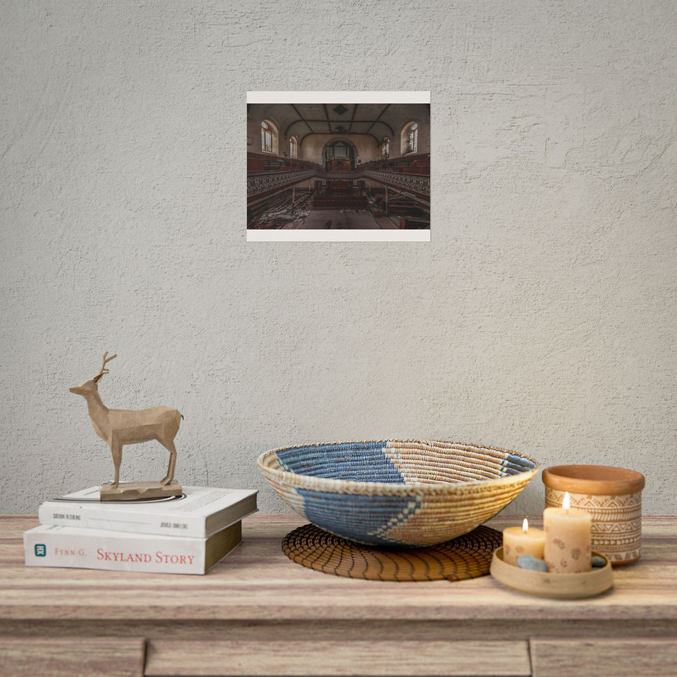 Thumbnail: Framed picture of building interior above decorative deer, books, woven bowl.