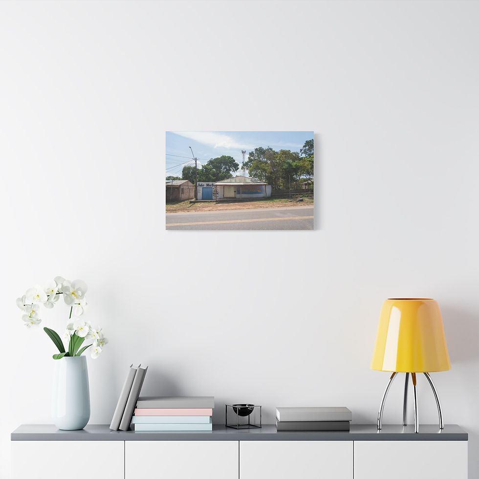 Thumbnail: Rural building, unpaved road, green trees, and blue sky.