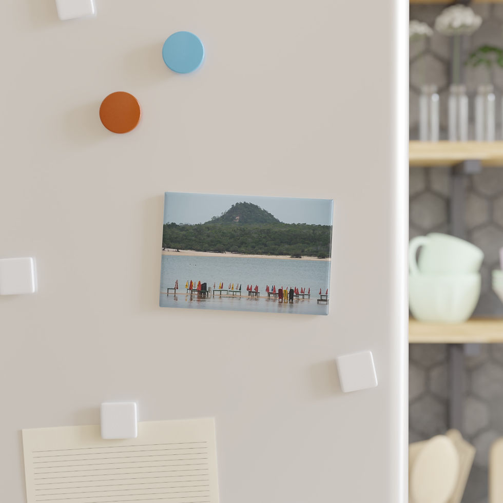 Thumbnail: Refrigerator magnet featuring a beach scene with people and green mountain.