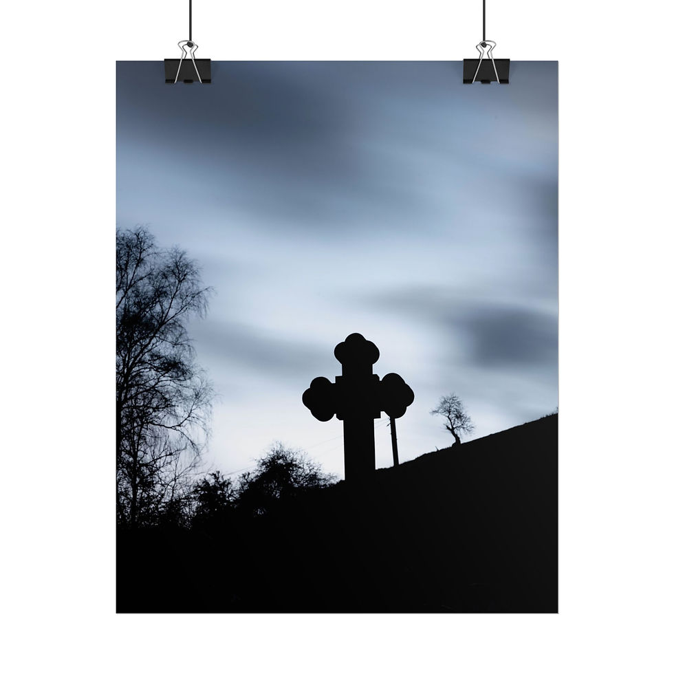 Thumbnail: Dark silhouette of cross, bare trees, against cloudy twilight sky.