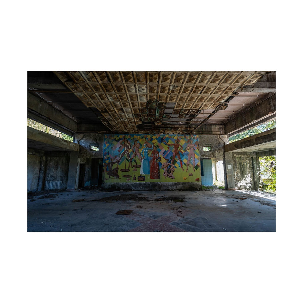 Thumbnail: Abandoned building interior with colorful mural, collapsed ceiling, and debris.