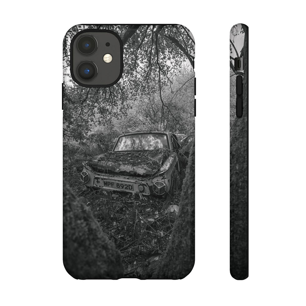 Thumbnail: Abandoned, rusted car in overgrown forest on black and white phone case
