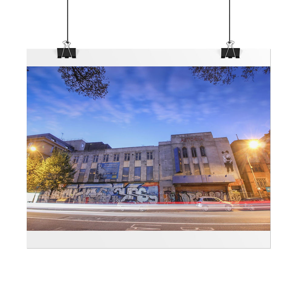 Thumbnail: Urban building at dusk with graffiti, streetlights, and car light trails.
