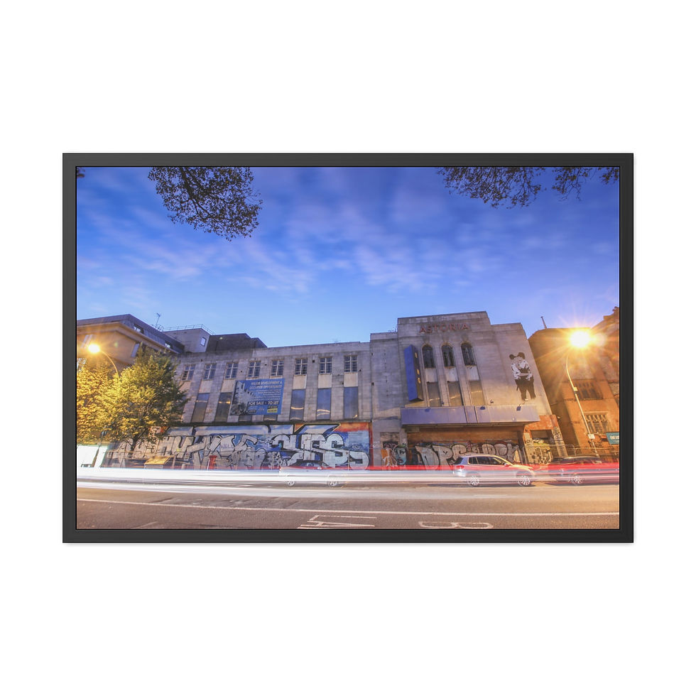 Thumbnail: Large old building with graffiti at night, light trails on street.