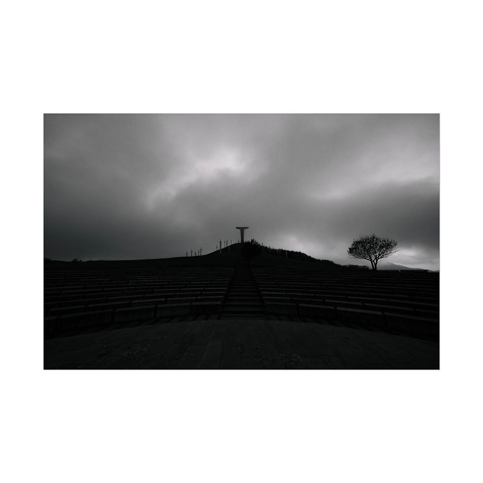 Thumbnail: Dark silhouetted figure with outstretched arms on hill under dramatic sky.