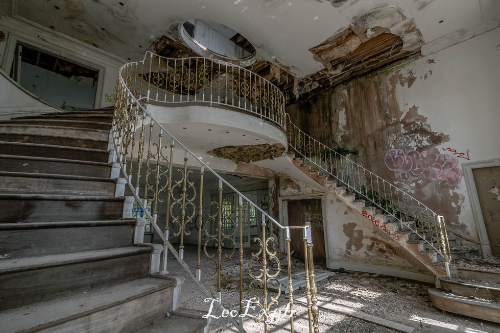 Two ways lead up this staircase of a very decayed and rotting mansion