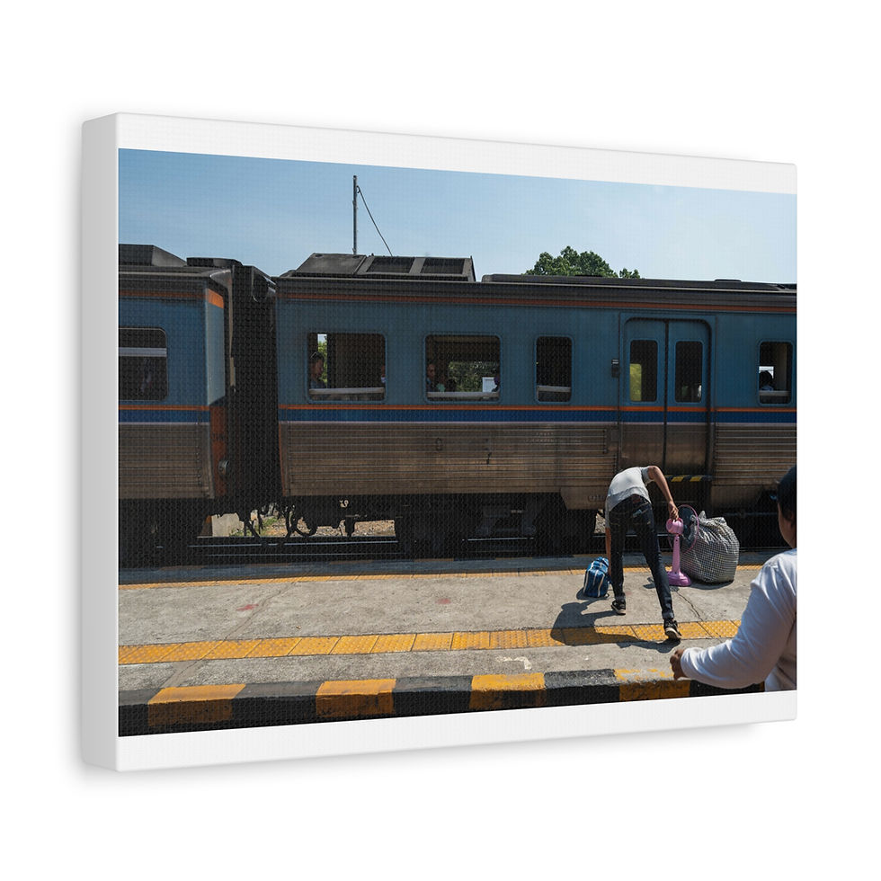 Thumbnail: People wait on platform beside blue train at Thailand station.