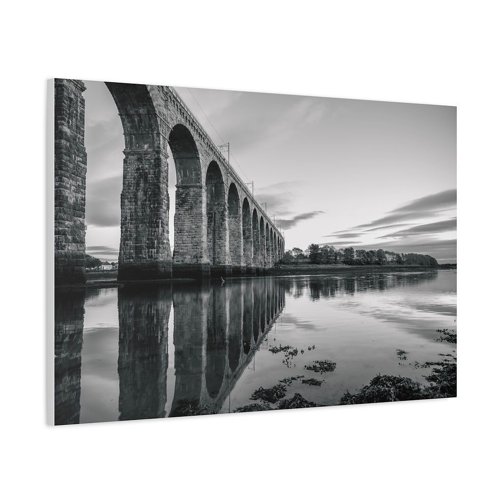 Thumbnail: Black and white arched stone viaduct reflected in calm water.