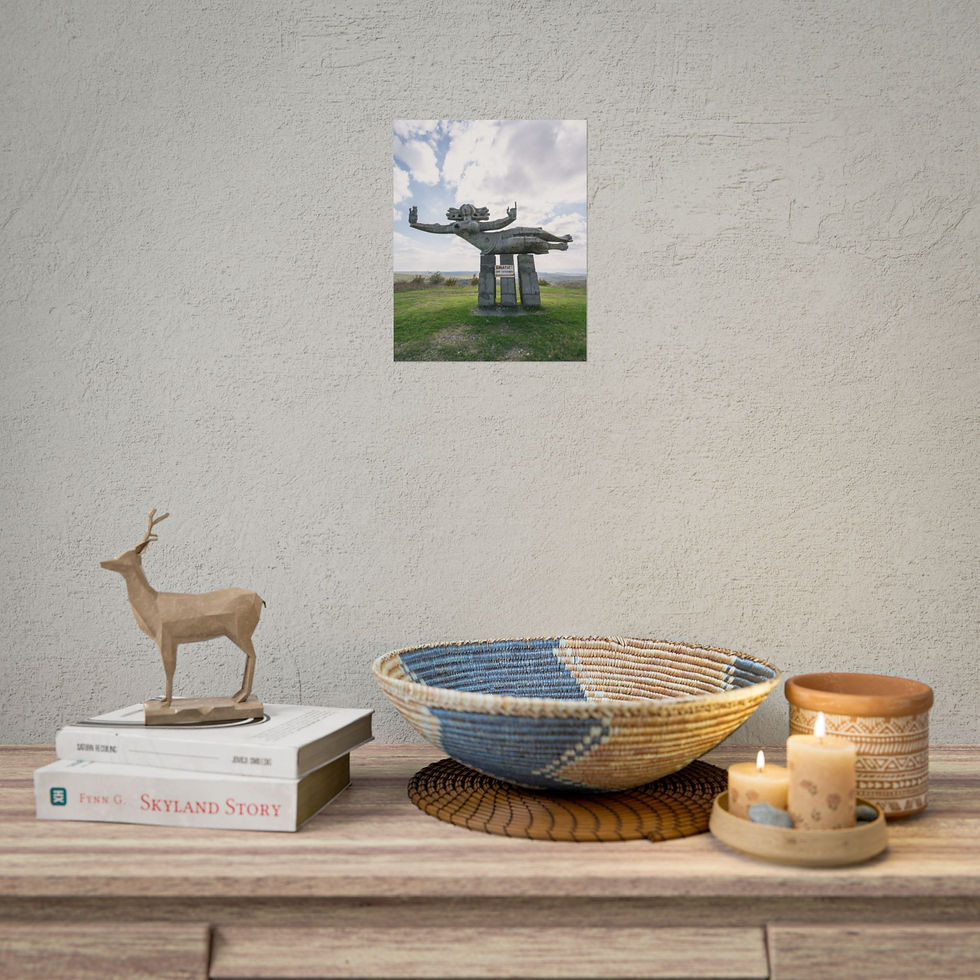 Thumbnail: Framed photo of weathered stone monument on wall above home decor.