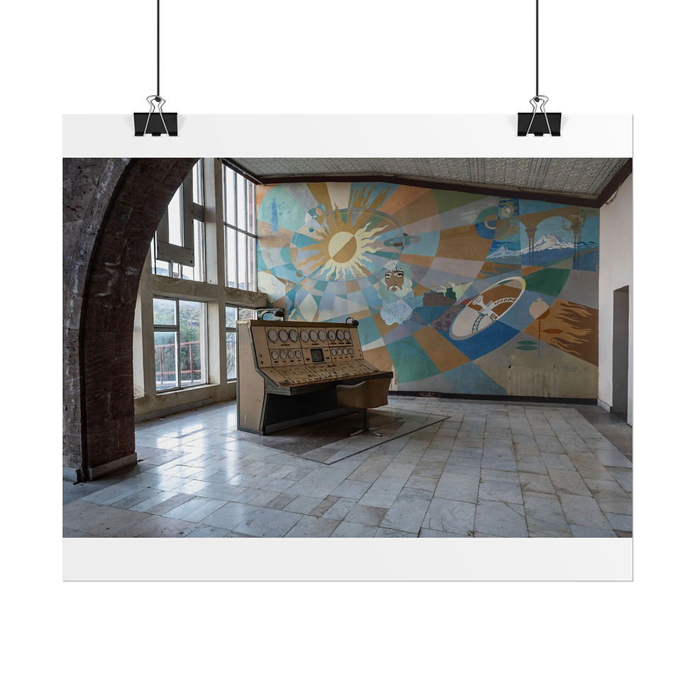 Thumbnail: Abandoned control console in room with vibrant abstract sun mural.