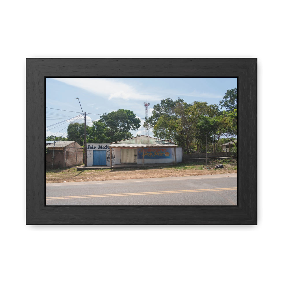 Thumbnail: Small blue rural building next to road with communication tower, trees.