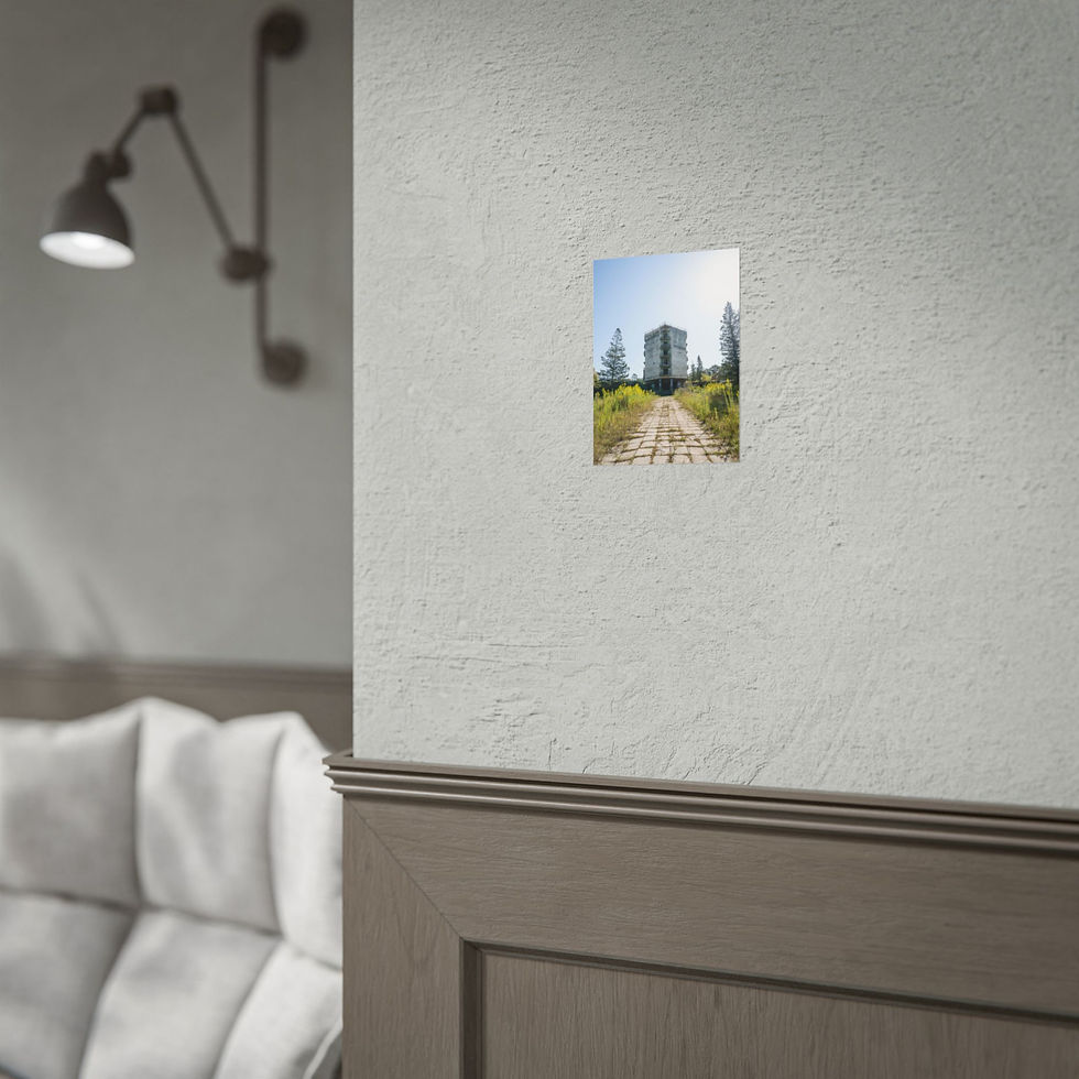 Thumbnail: Framed print of a tall building and path on a white wall.
