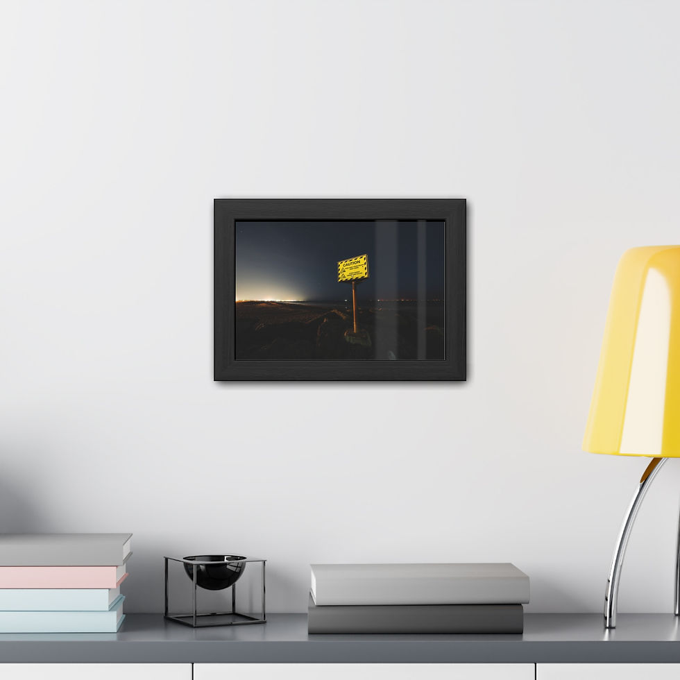 Thumbnail: Dark framed print of yellow desert road sign hanging above modern shelf.