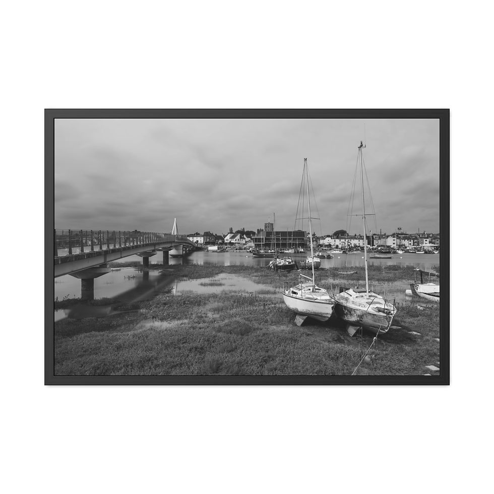 Thumbnail: Monochrome photo showing beached sailboats on estuary mudflats and distant bridge.